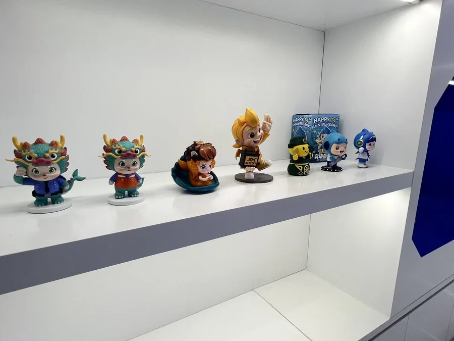 A display row of custom mascot and character figures in different forms and poses